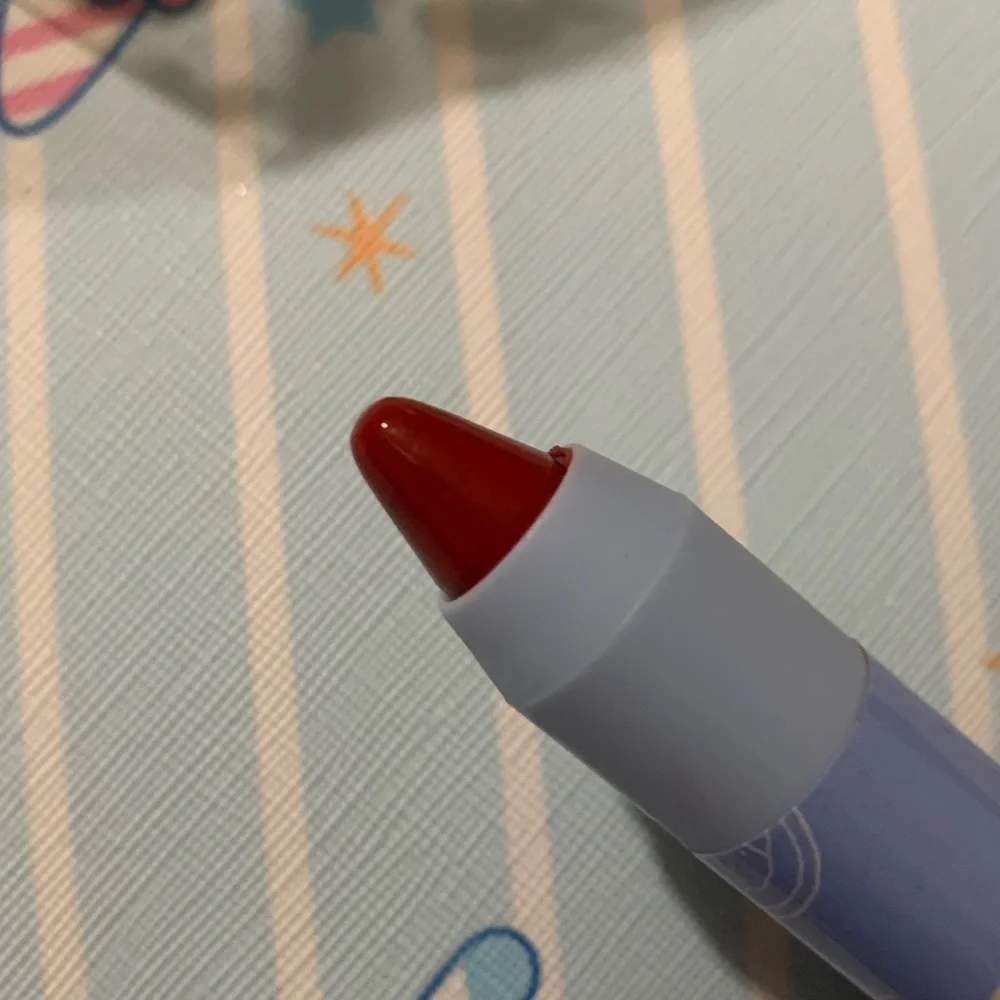 Red Twist-Up Lip Crayon in Triangle Packaging with Hang String